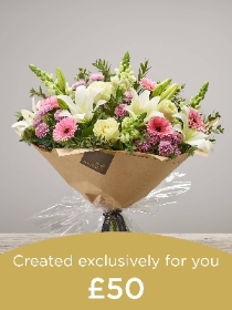 Hand tied bouquet made with seasonal flowers